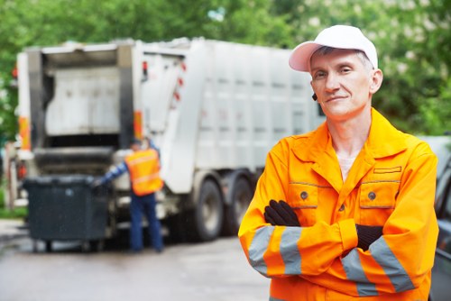 Garbage trucks parked in a North London street collecting waste