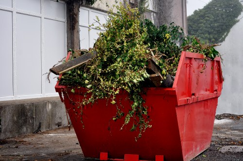 Workers sorting different types of waste in a recycling facility